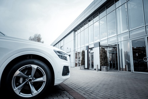 White-car-parked-outside-car-dealership